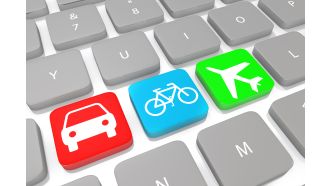 Three icons of travel on keys of keyboard stock photo